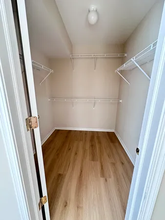 a view of wooden floor in an empty room