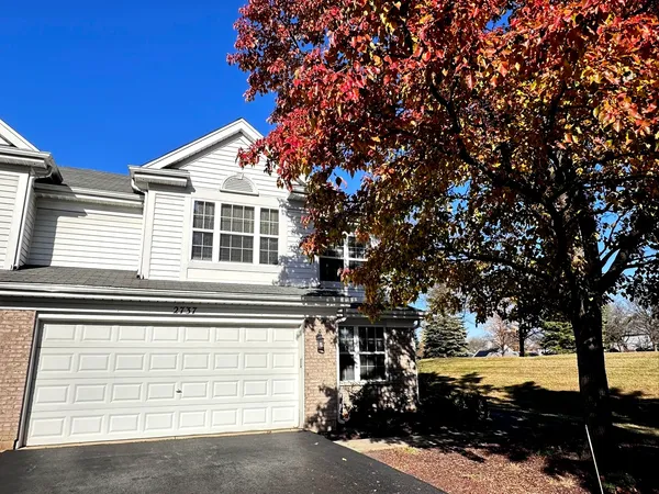 a view of a house with a tree and a tree