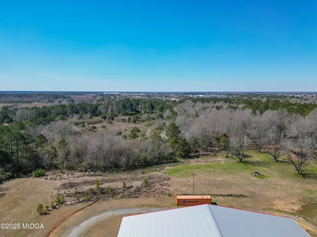 an aerial view of a yard with trees