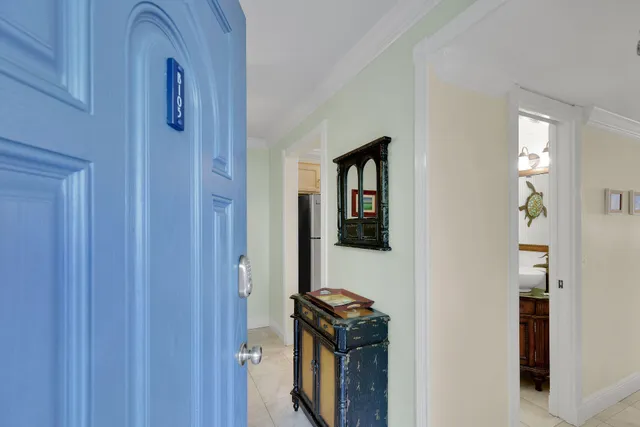 a living room with furniture a large window and a table