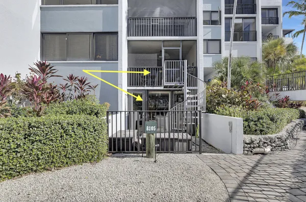 a kitchen that has a stove a table and chairs