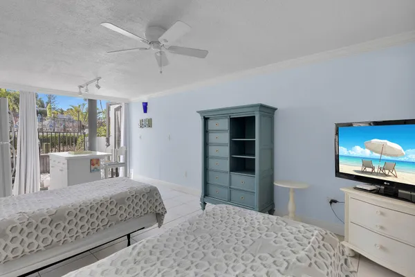 a view of a living room and kitchen with a large window