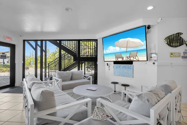 a view of swimming pool with outdoor seating and plants