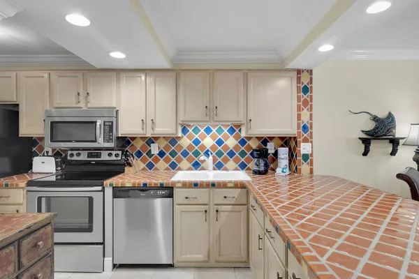 a view of a room with a table and chairs