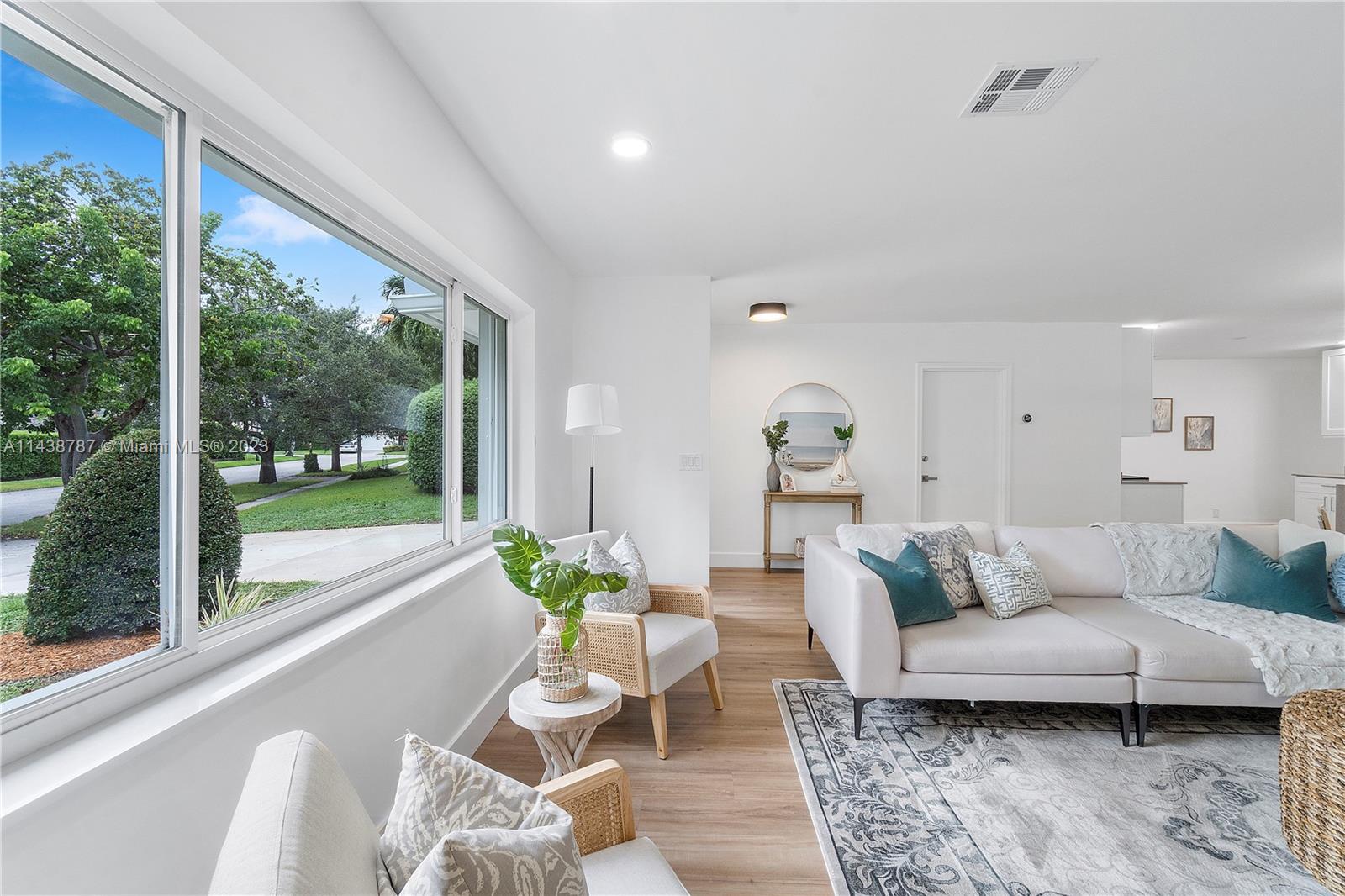 900 Northwest 9th Way Boca Raton, FL 33486 - Photo 19 of 48 a living room with furniture and a large window