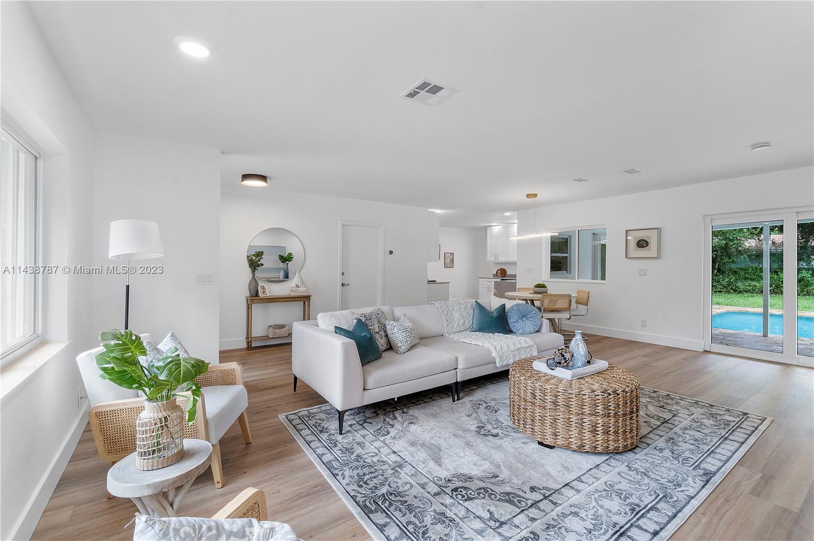 900 Northwest 9th Way Boca Raton, FL 33486 - Photo 20 of 48 a living room with furniture potted plant and wooden floor