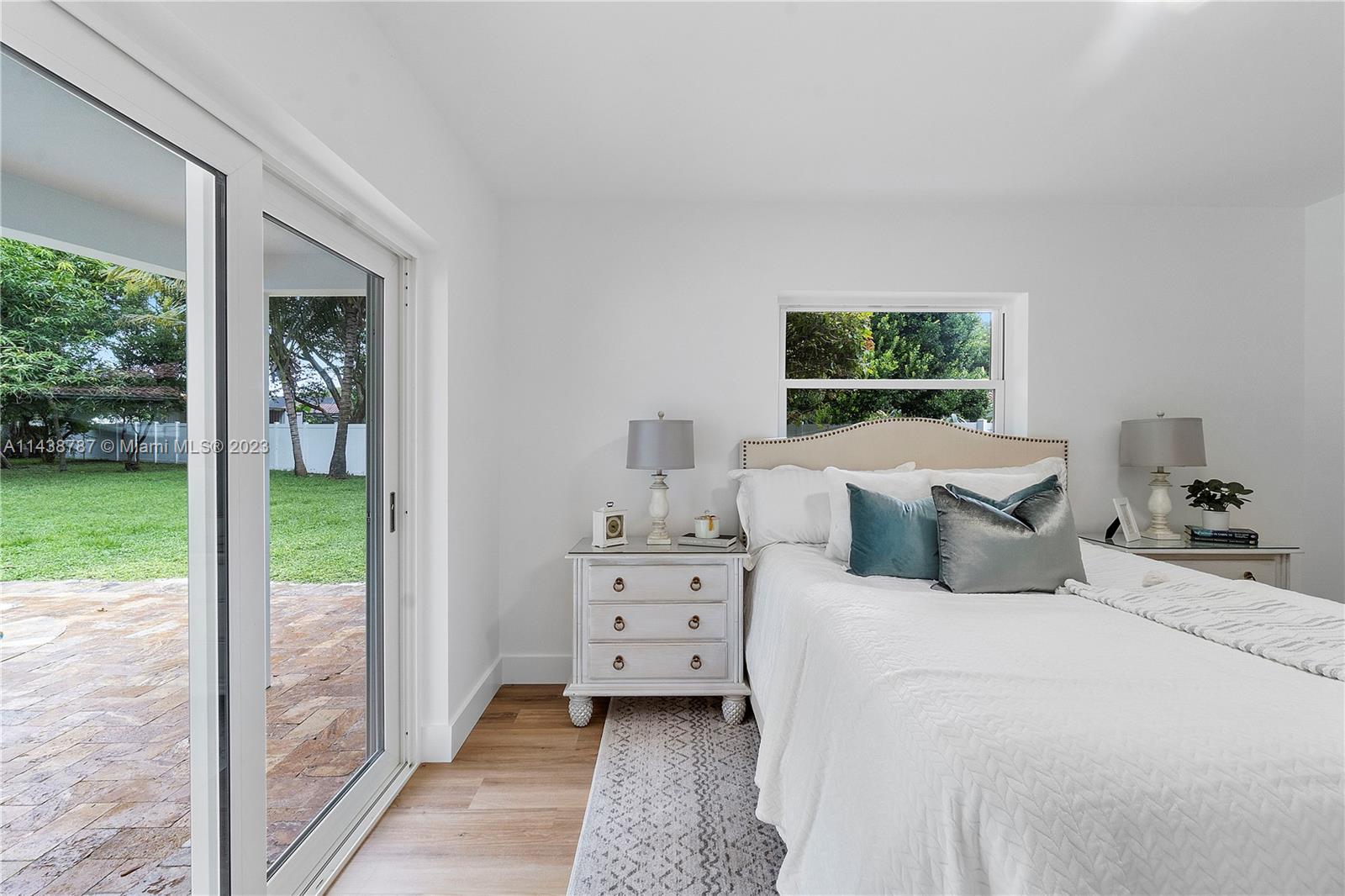 900 Northwest 9th Way Boca Raton, FL 33486 - Photo 21 of 48 a bedroom with a bed and a window