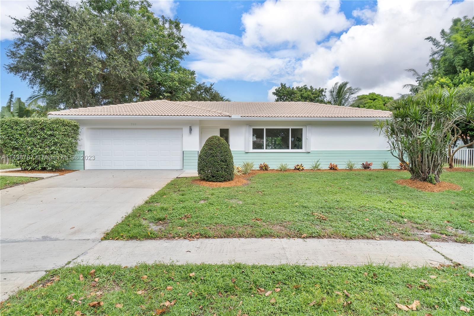 900 Northwest 9th Way Boca Raton, FL 33486 - Photo 3 of 48 a view of a house with a yard