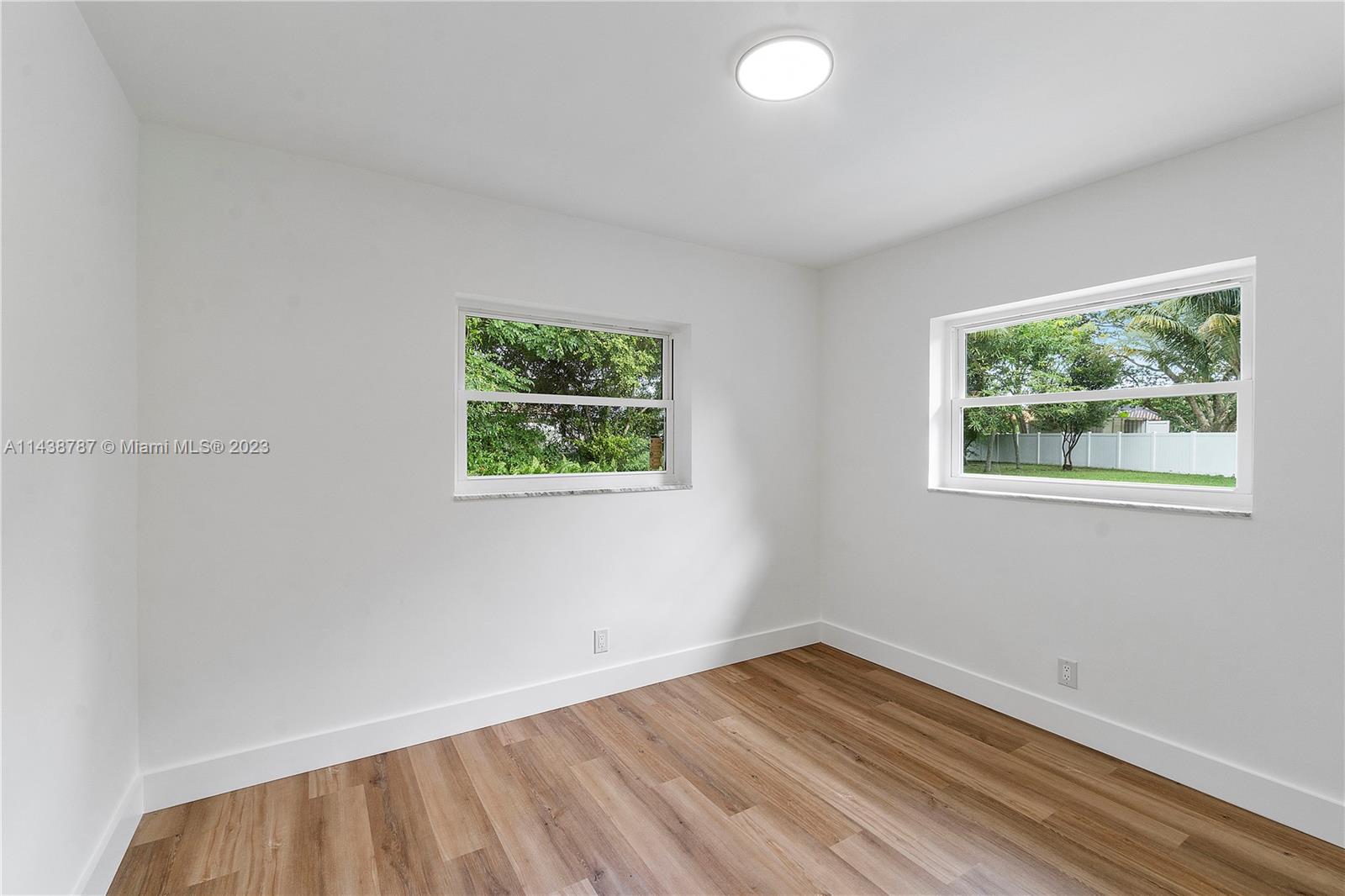 900 Northwest 9th Way Boca Raton, FL 33486 - Photo 36 of 48 an empty room with a window