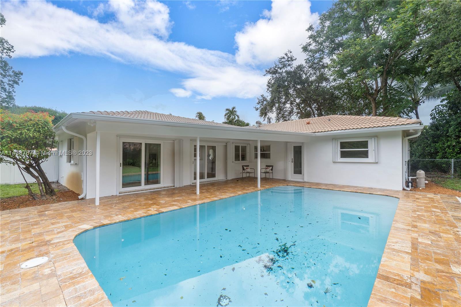 900 Northwest 9th Way Boca Raton, FL 33486 - Photo 41 of 48 a view of a house with a swimming pool