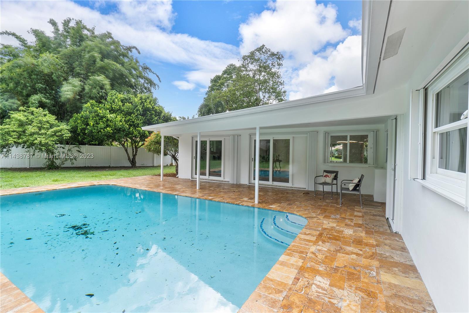 900 Northwest 9th Way Boca Raton, FL 33486 - Photo 45 of 48 a view of a house with swimming pool and sitting area