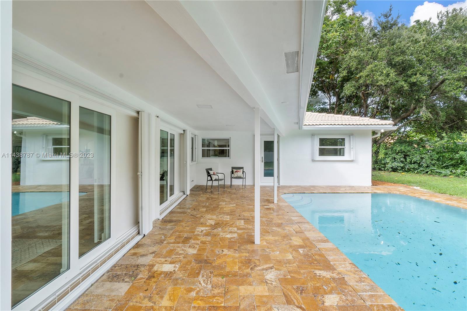 900 Northwest 9th Way Boca Raton, FL 33486 - Photo 46 of 48 a view of backyard with large trees and plants