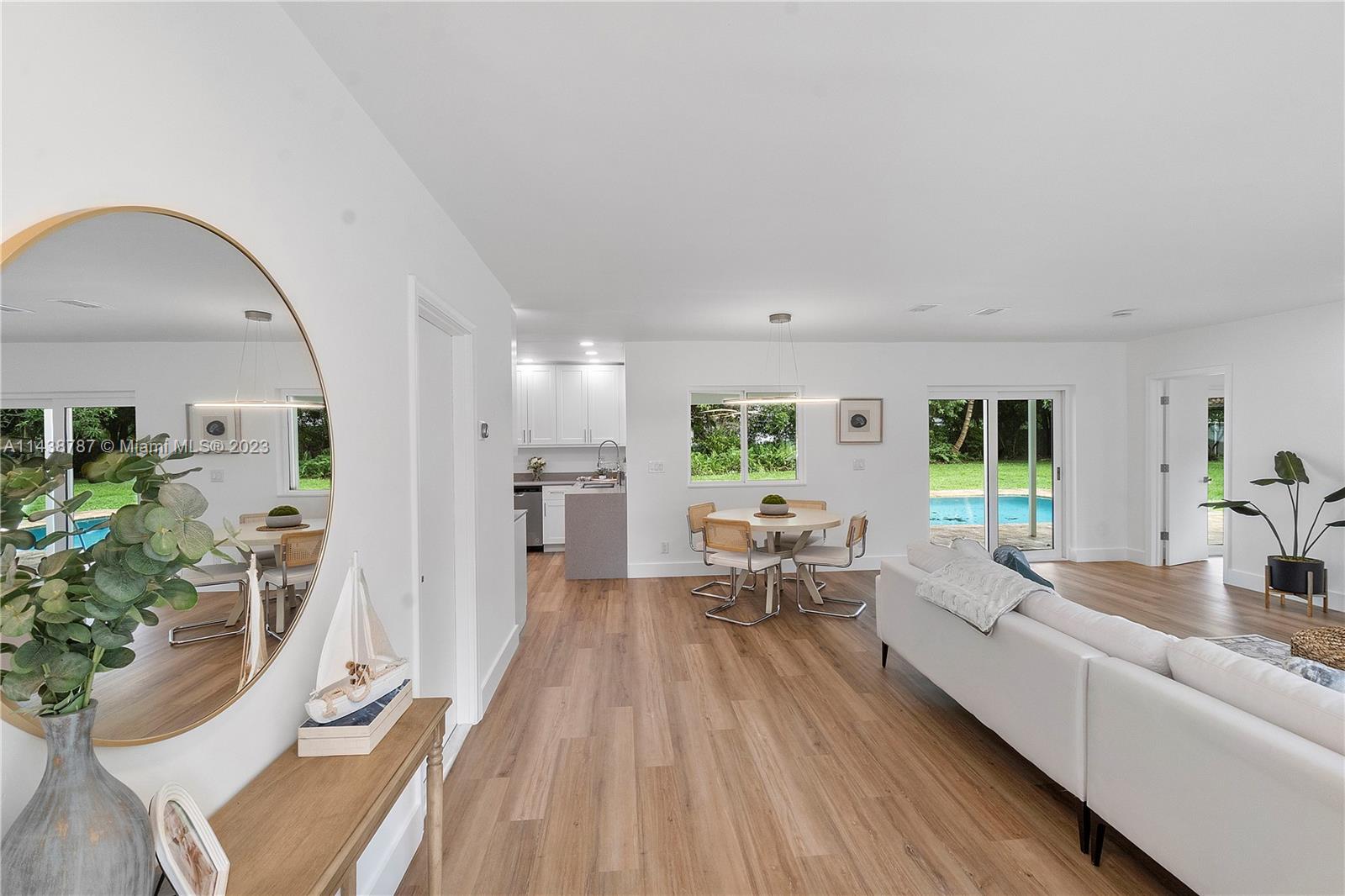 900 Northwest 9th Way Boca Raton, FL 33486 - Photo 6 of 48 a living room with furniture and a large window