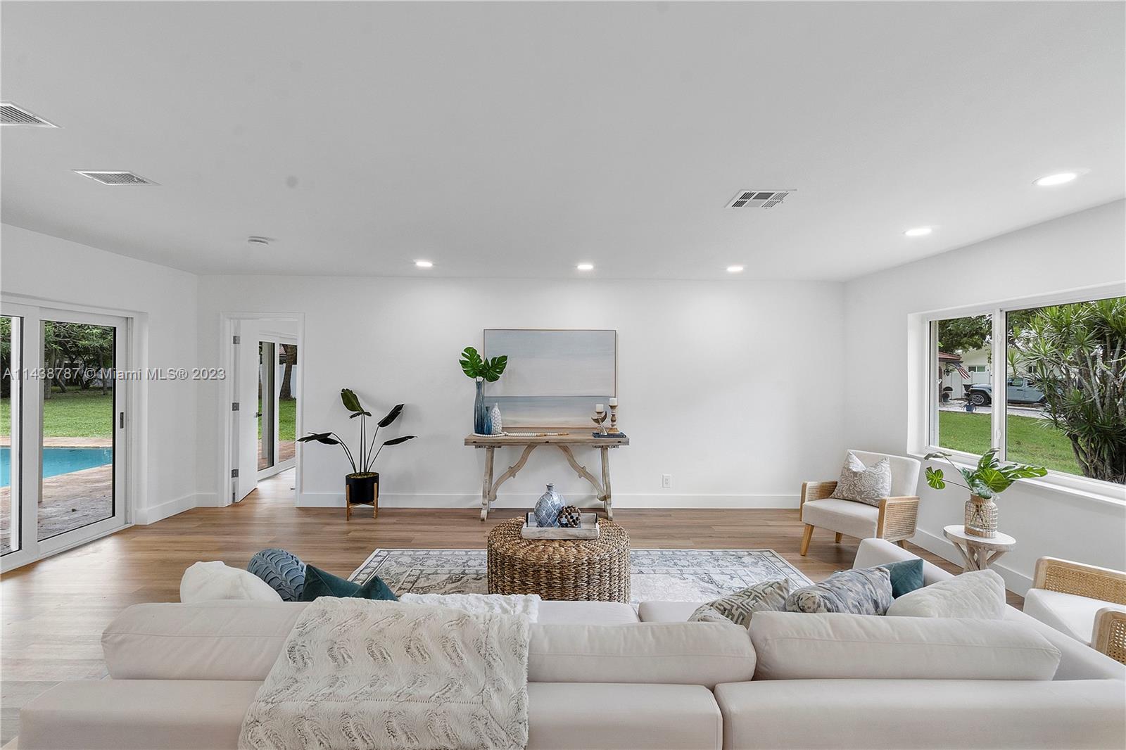 900 Northwest 9th Way Boca Raton, FL 33486 - Photo 9 of 48 a living room with furniture and a couch