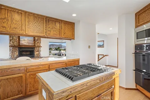 a view of a living room with kitchen