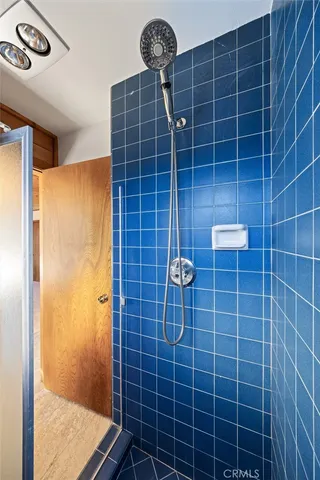 a view of balcony with wooden floor and fence