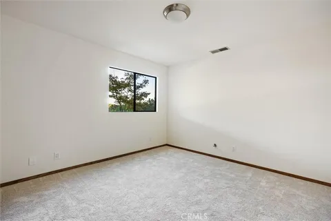 a view of a storage & utility room with window