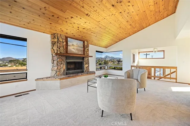 a living room with furniture a window and a fireplace