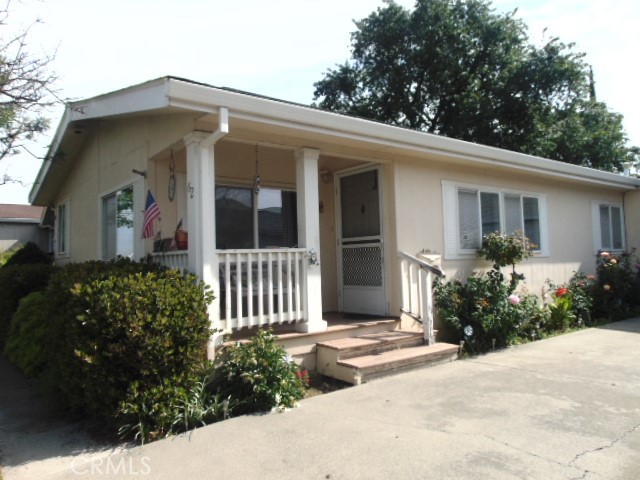 3835 Gardiner Ferry Road, Unit 62 Corning, CA 96021 - Photo 2 of 34 a front view of a house with garden
