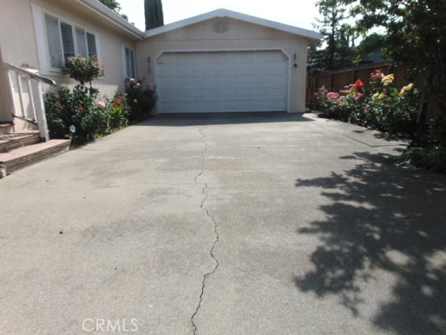 3835 Gardiner Ferry Road, Unit 62 Corning, CA 96021 - Photo 3 of 34 a front view of house with a garden