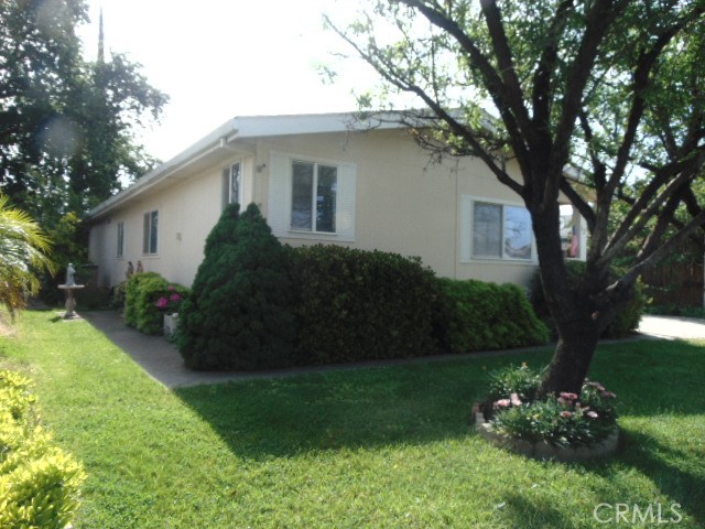 3835 Gardiner Ferry Road, Unit 62 Corning, CA 96021 - Photo 5 of 34 a view of a house with a yard and potted plants