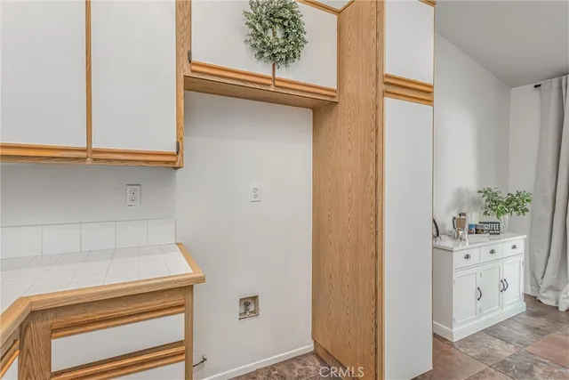 a bathroom with a granite countertop sink mirror vanity and toilet