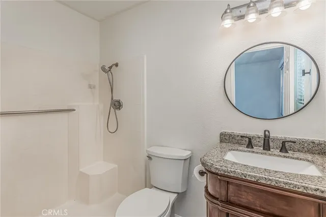 a view of patio with a table and chairs and potted plants