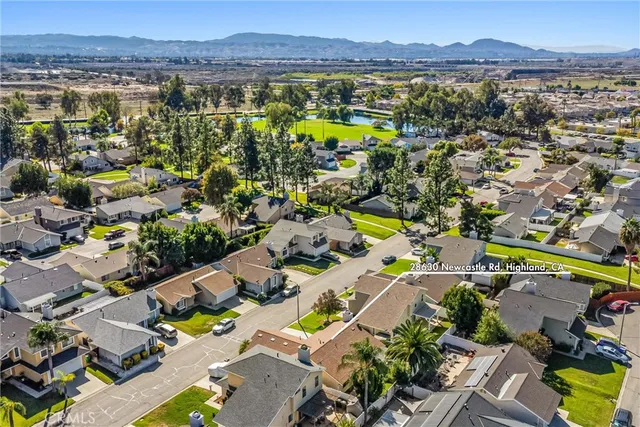a view of a swimming pool with a yard