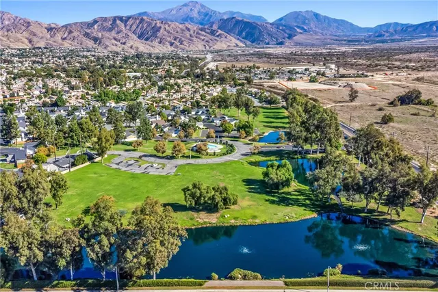 a view of a swimming pool with a yard
