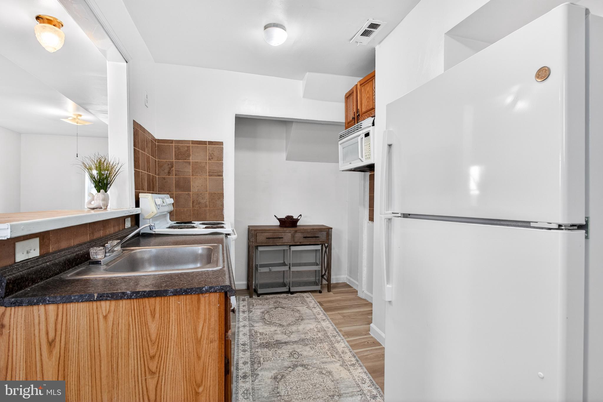 1118 Sterling Avenue Linwood, PA 19061 - Photo 15 of 38 a kitchen with refrigerator and window
