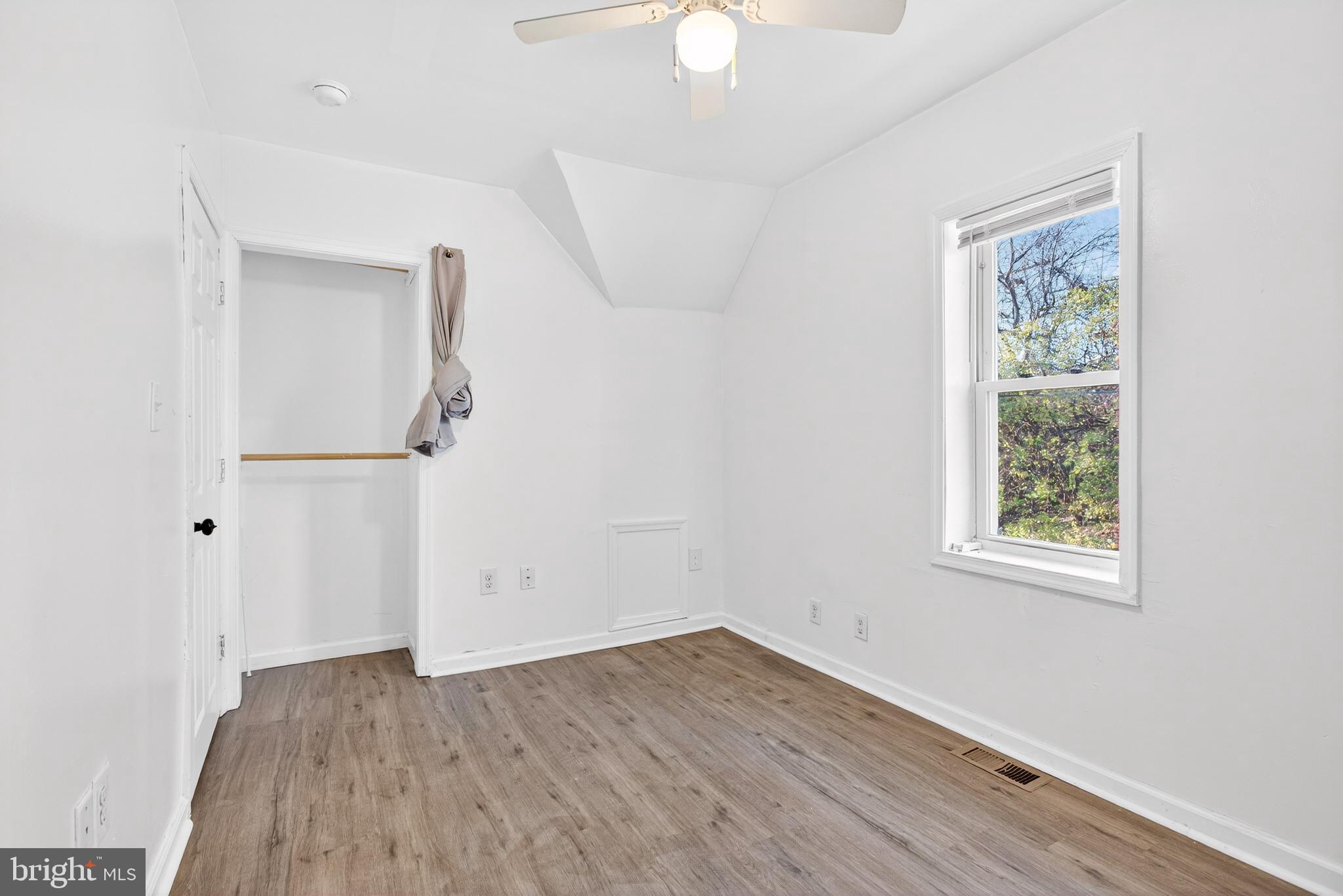 1118 Sterling Avenue Linwood, PA 19061 - Photo 26 of 38 an empty room with a window and wooden floor