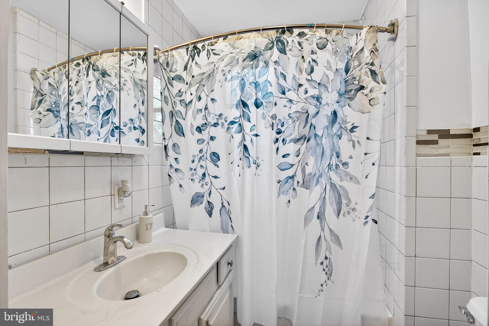 1118 Sterling Avenue Linwood, PA 19061 - Photo 30 of 38 a bathroom with a sink and a mirror