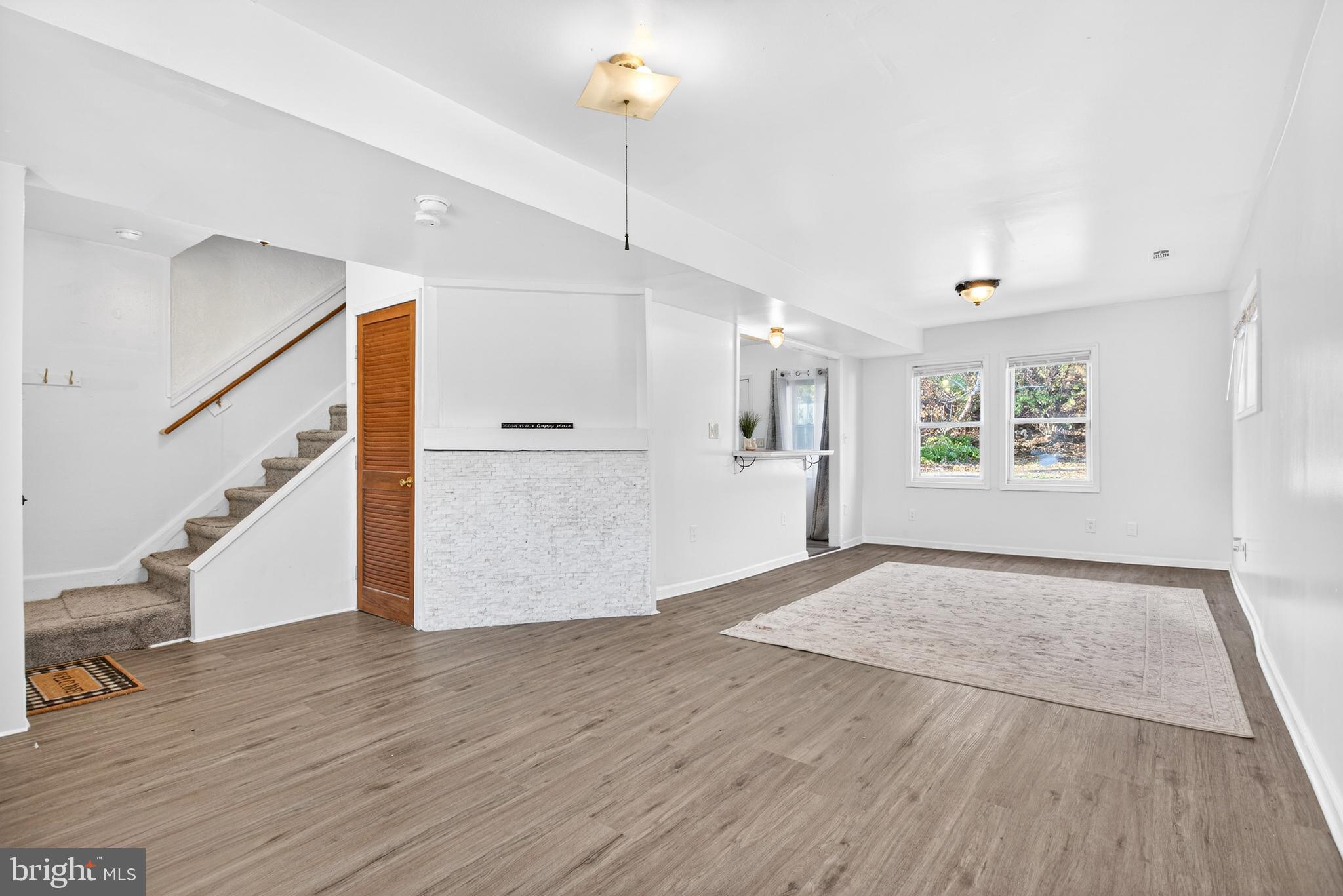 1118 Sterling Avenue Linwood, PA 19061 - Photo 6 of 38 a view of an empty room with wooden floor and a window