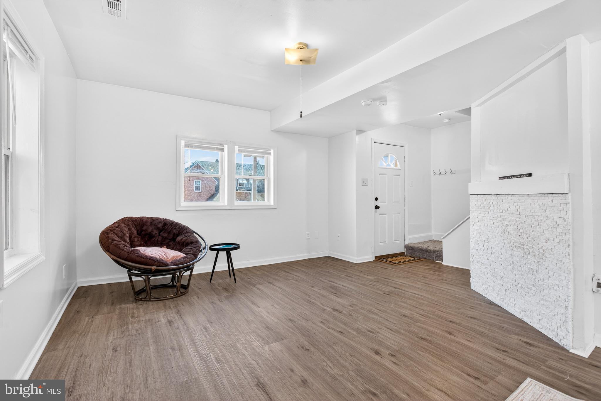 1118 Sterling Avenue Linwood, PA 19061 - Photo 7 of 38 a view of a workspace with wooden floor and a chandelier