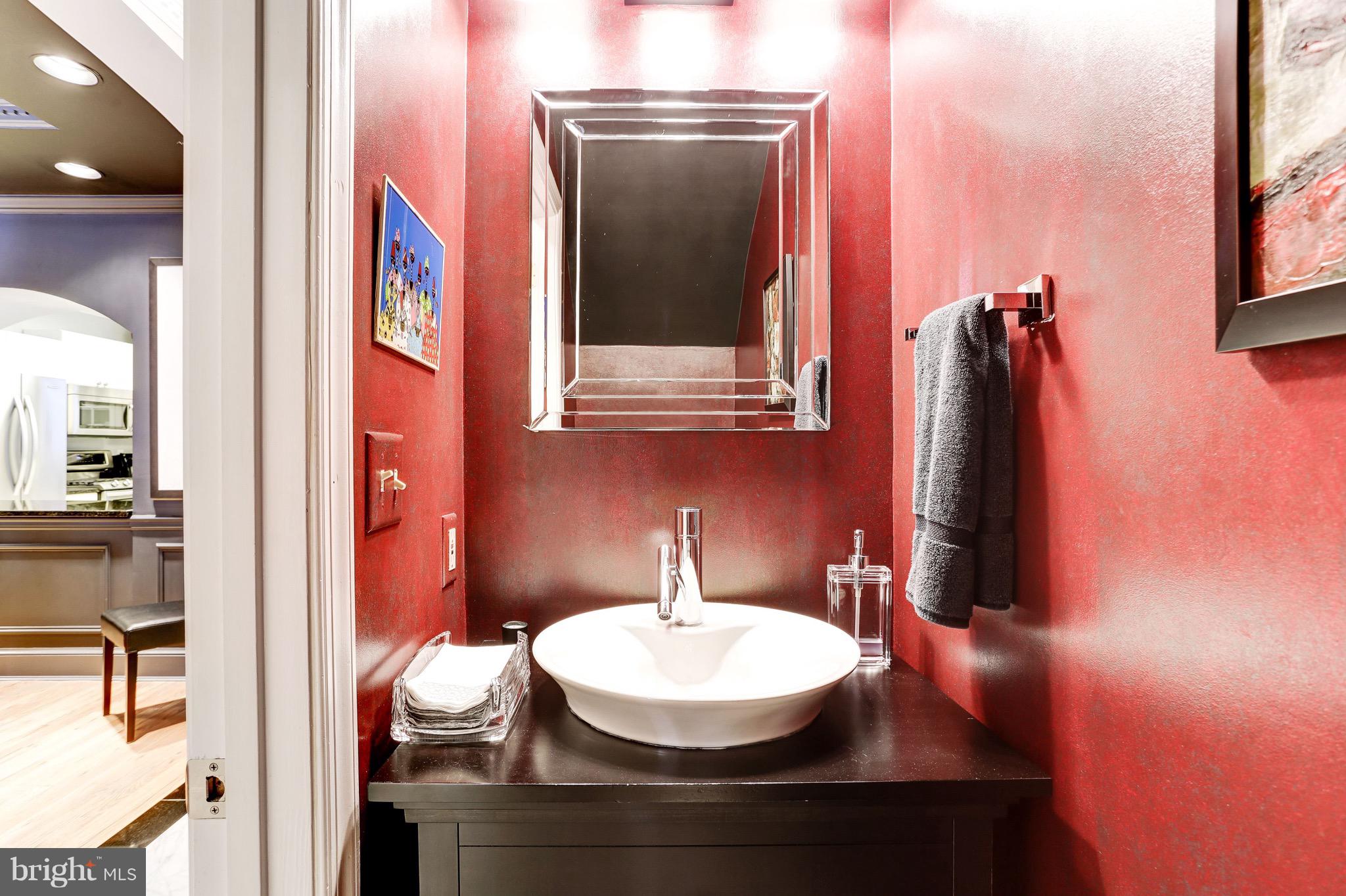 224 9th Street Southeast Washington, DC 20003 - Photo 12 of 29 a bathroom with a sink and a mirror