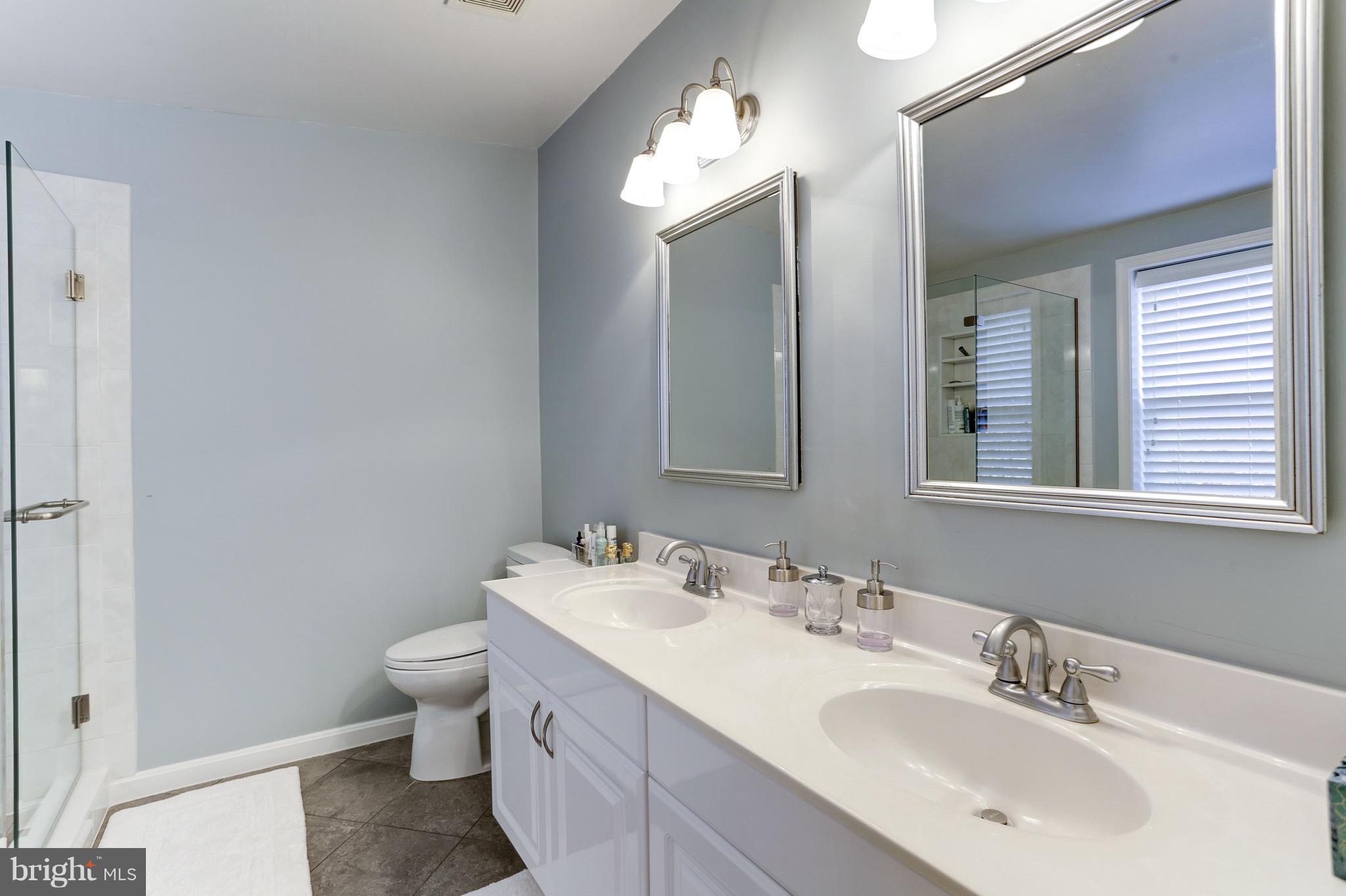 224 9th Street Southeast Washington, DC 20003 - Photo 17 of 29 a bathroom with 2 sink and a mirror