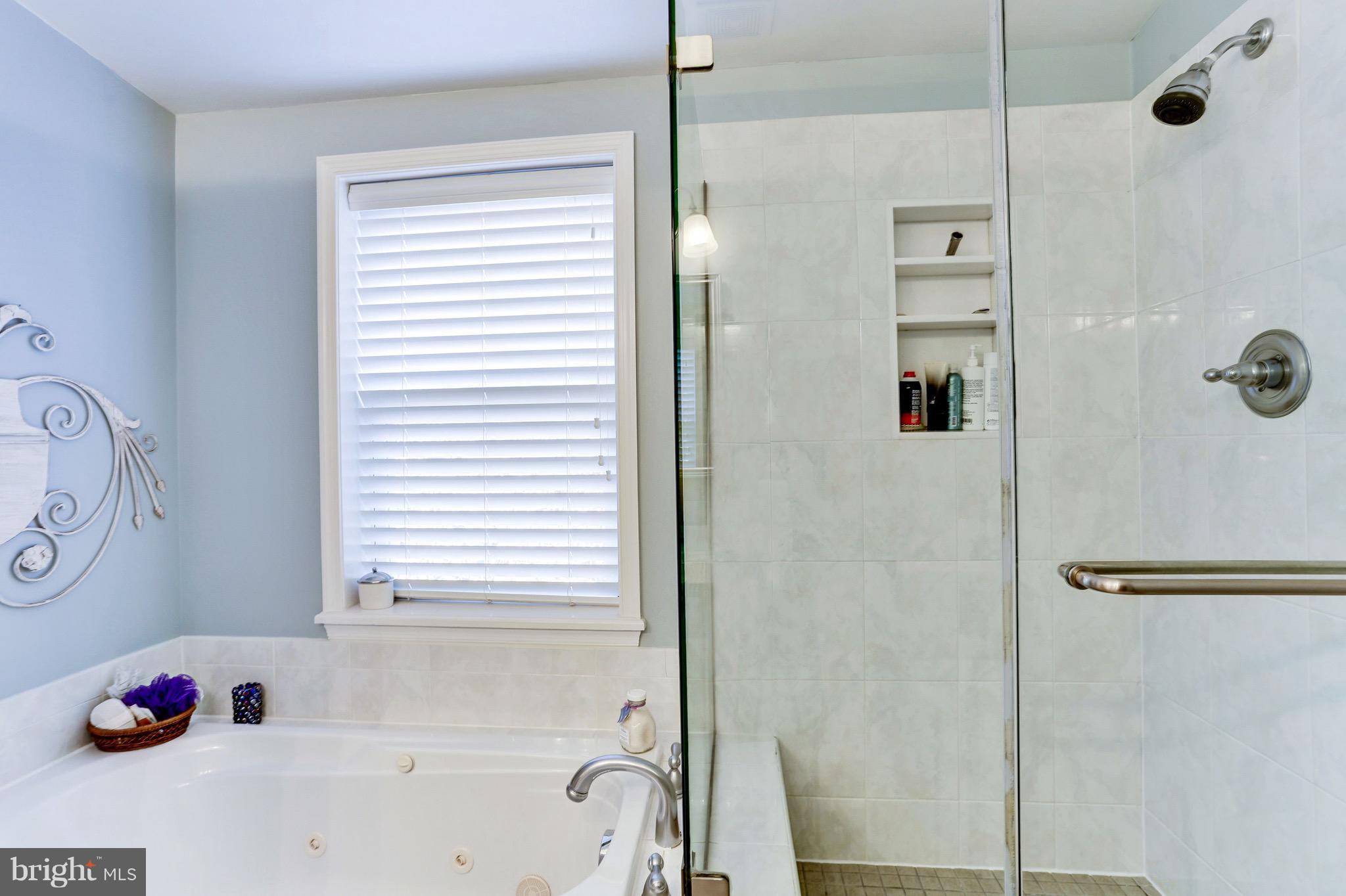 224 9th Street Southeast Washington, DC 20003 - Photo 18 of 29 a bathroom with a tub and shower