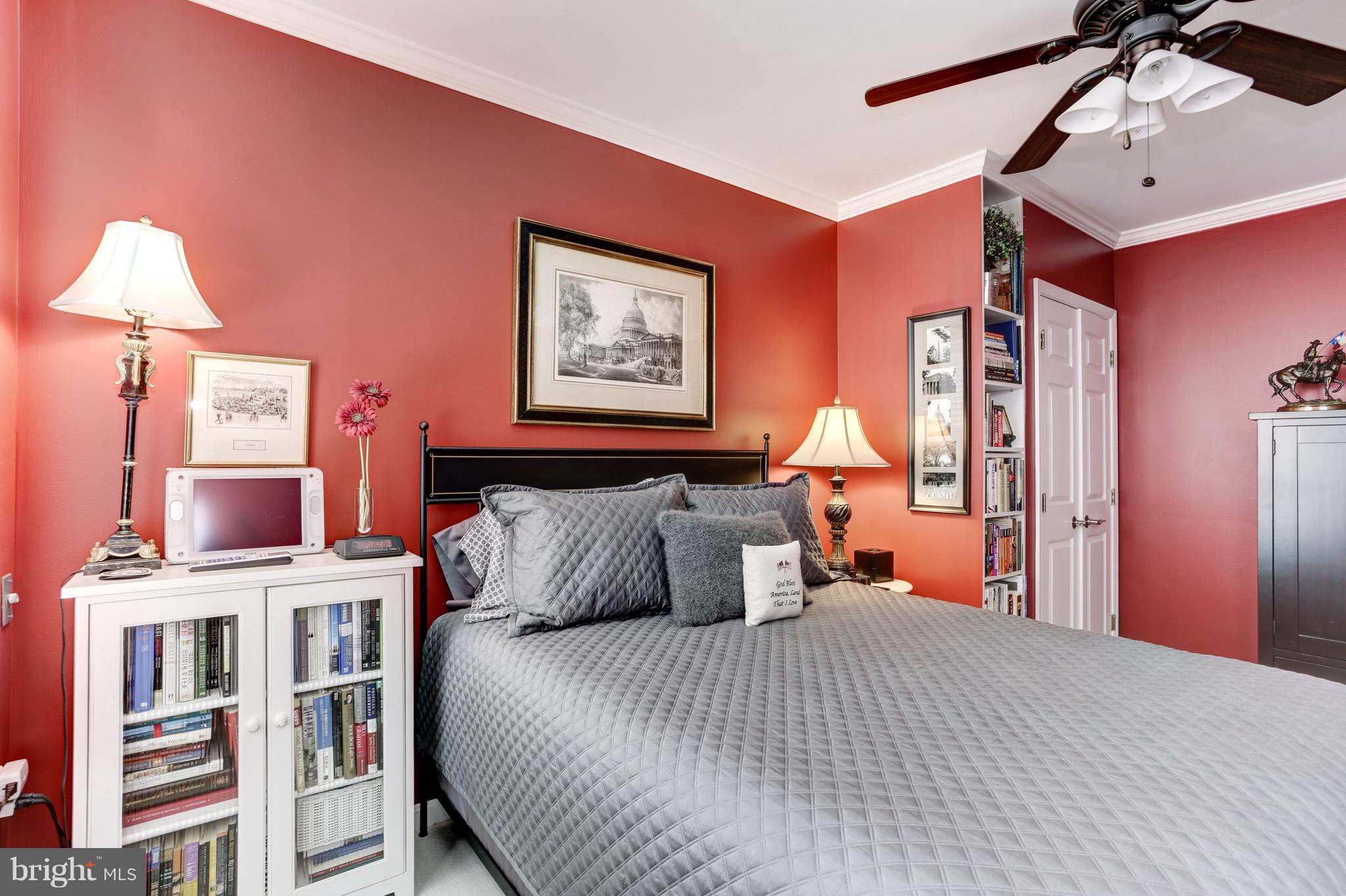 224 9th Street Southeast Washington, DC 20003 - Photo 20 of 29 a bedroom with a bed and a chandelier