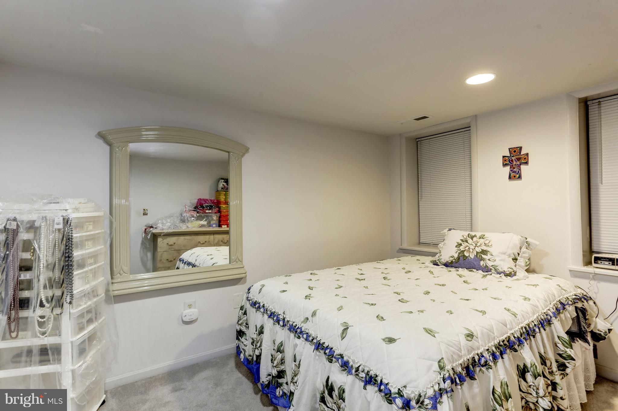 224 9th Street Southeast Washington, DC 20003 - Photo 24 of 29 a bedroom with a bed and a dresser