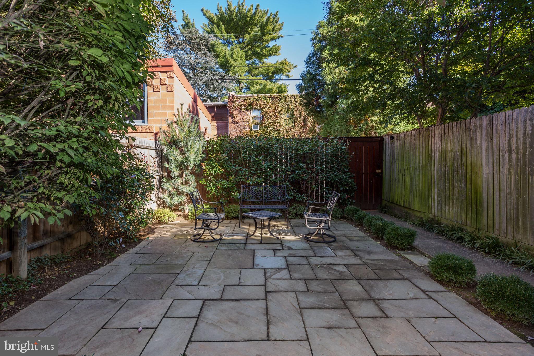 224 9th Street Southeast Washington, DC 20003 - Photo 27 of 29 a view of backyard with a table and chairs and potted plants