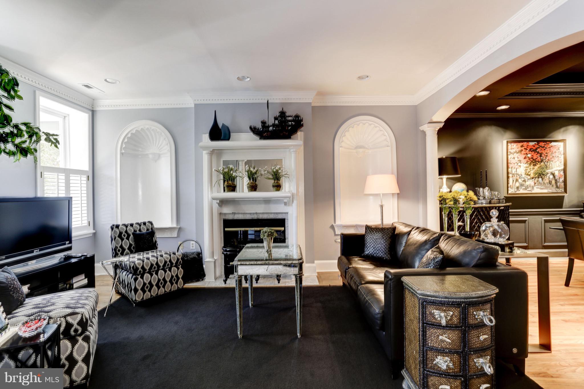 224 9th Street Southeast Washington, DC 20003 - Photo 4 of 29 a living room with furniture and a flat screen tv