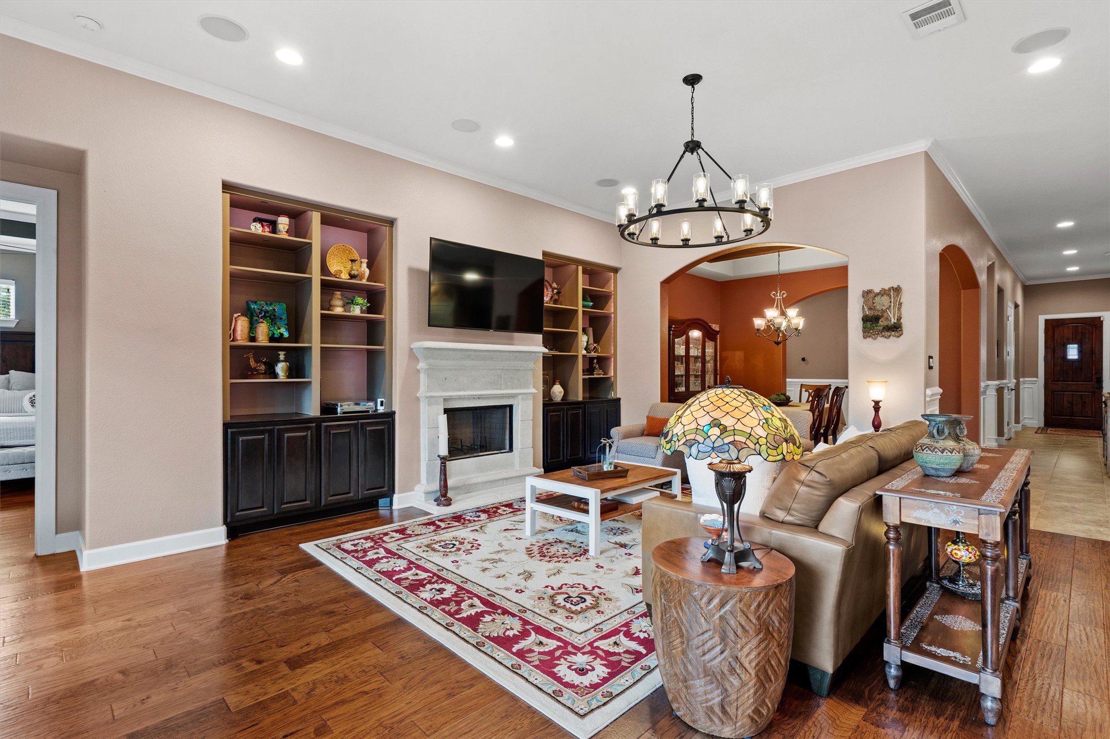 4005 Haight Street Round Rock, TX 78681 - Photo 15 of 40 a living room with furniture a fireplace and a flat screen tv