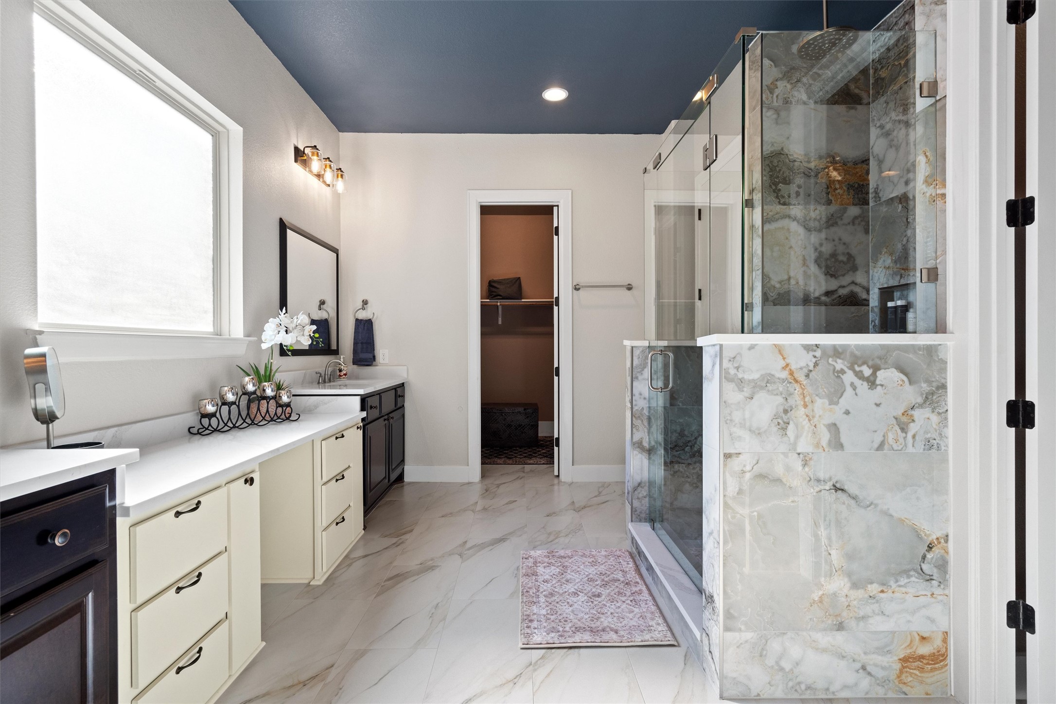 4005 Haight Street Round Rock, TX 78681 - Photo 22 of 40 a bathroom with a double vanity sink toilet and shower