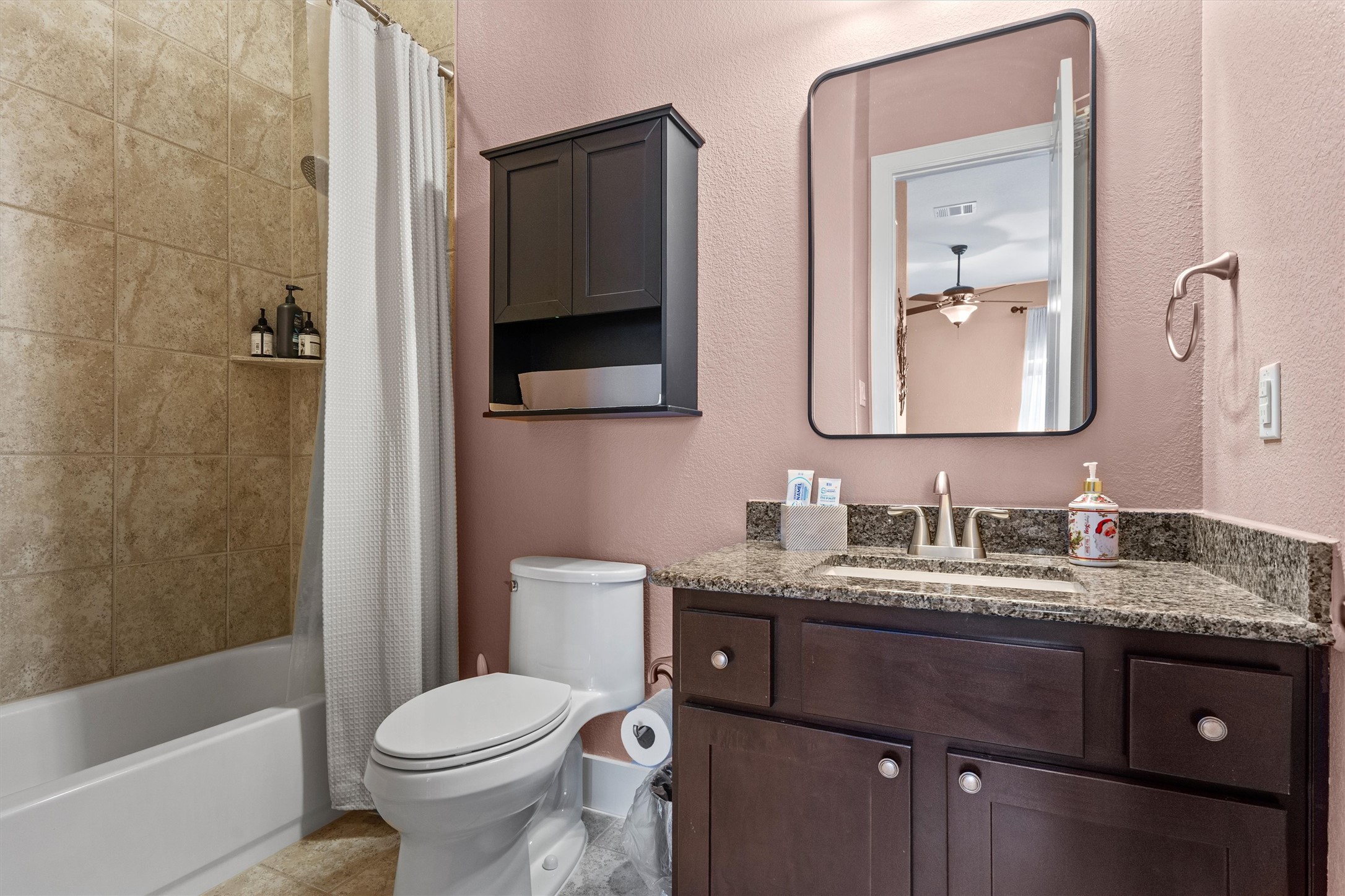 4005 Haight Street Round Rock, TX 78681 - Photo 26 of 40 a bathroom with a granite countertop toilet sink and mirror