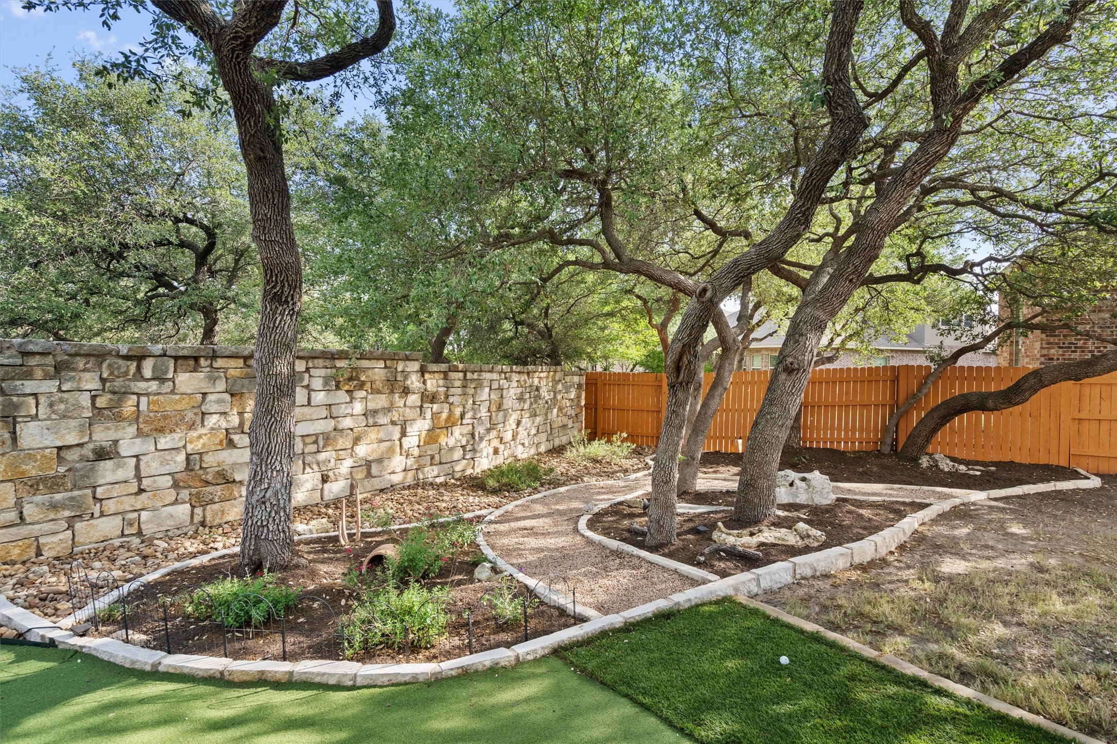4005 Haight Street Round Rock, TX 78681 - Photo 37 of 40 a view of a fire pit with large trees