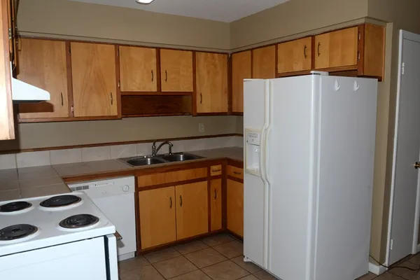 a utility room with sink dryer and washer