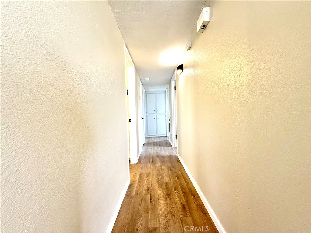 930 West Franklin Avenue Ridgecrest, CA 93555 - Photo 15 of 31 a view of a hallway with wooden floor