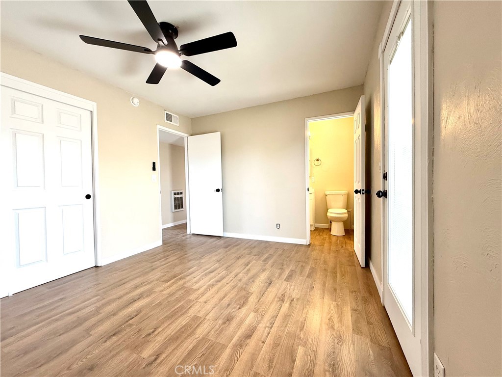 930 West Franklin Avenue Ridgecrest, CA 93555 - Photo 22 of 31 a view of empty room with wooden floor and fan