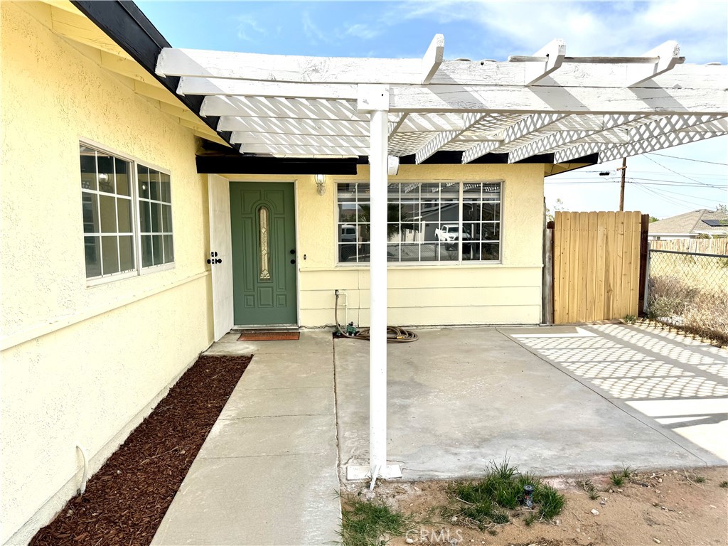 930 West Franklin Avenue Ridgecrest, CA 93555 - Photo 5 of 31 a view of a house with a wooden door