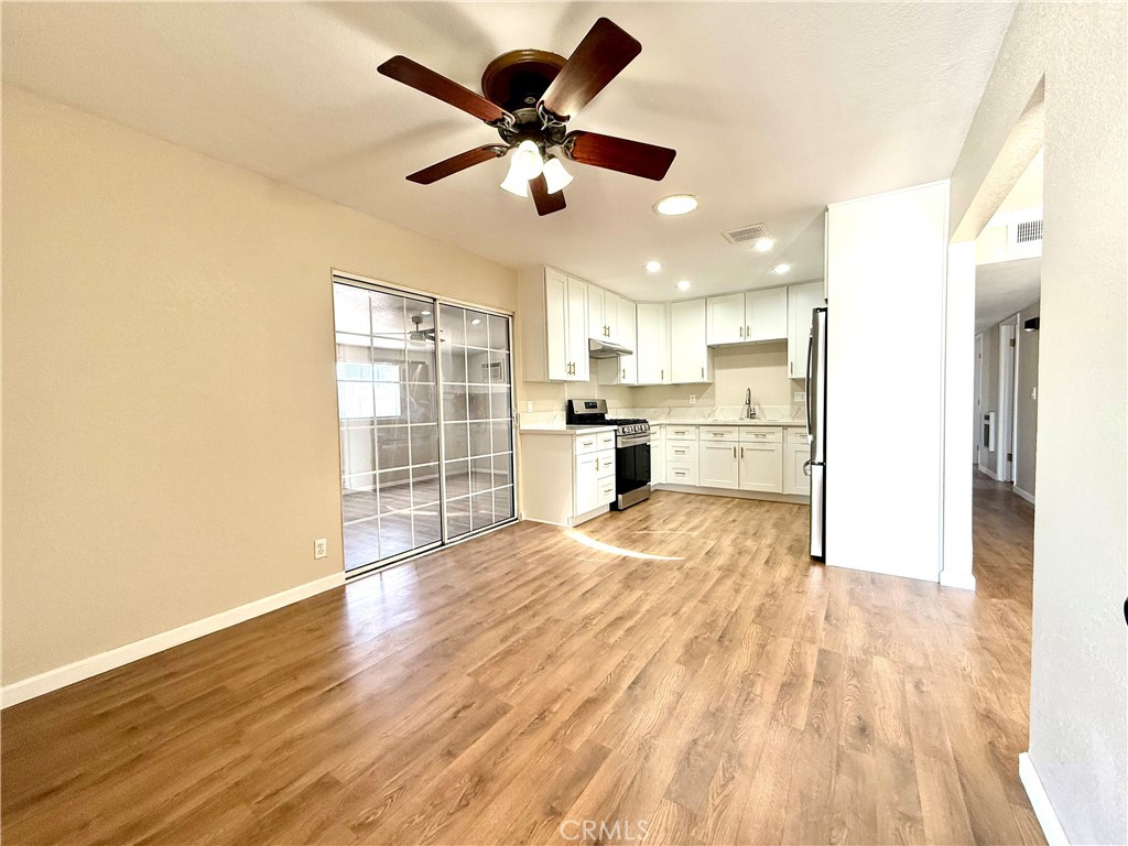 930 West Franklin Avenue Ridgecrest, CA 93555 - Photo 9 of 31 a view of empty room with wooden floor and window